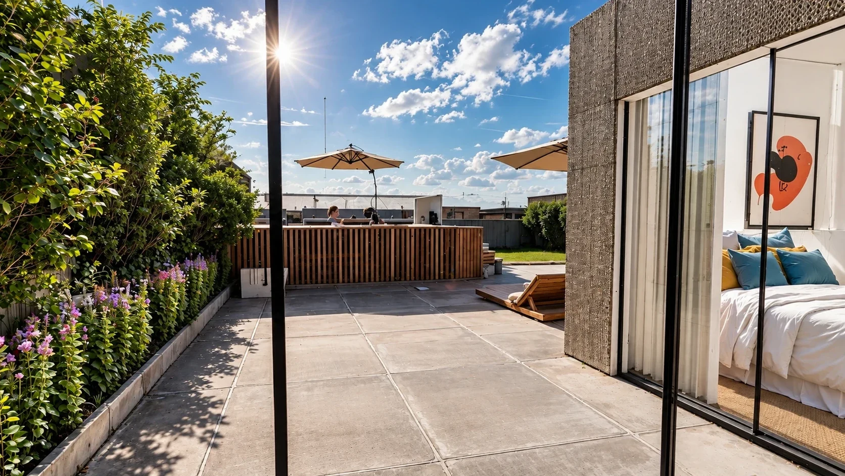 Glass-framed courtyard corridor between bedroom suite and salon with warm twilight glow.