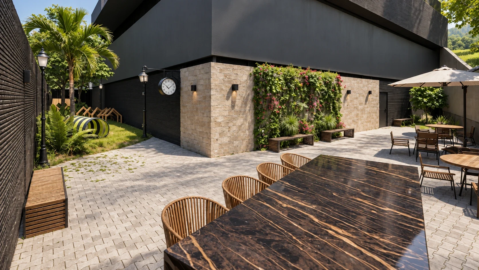 Courtyard with relaxed seating, vertical garden walls, and sunlit walking pathways.