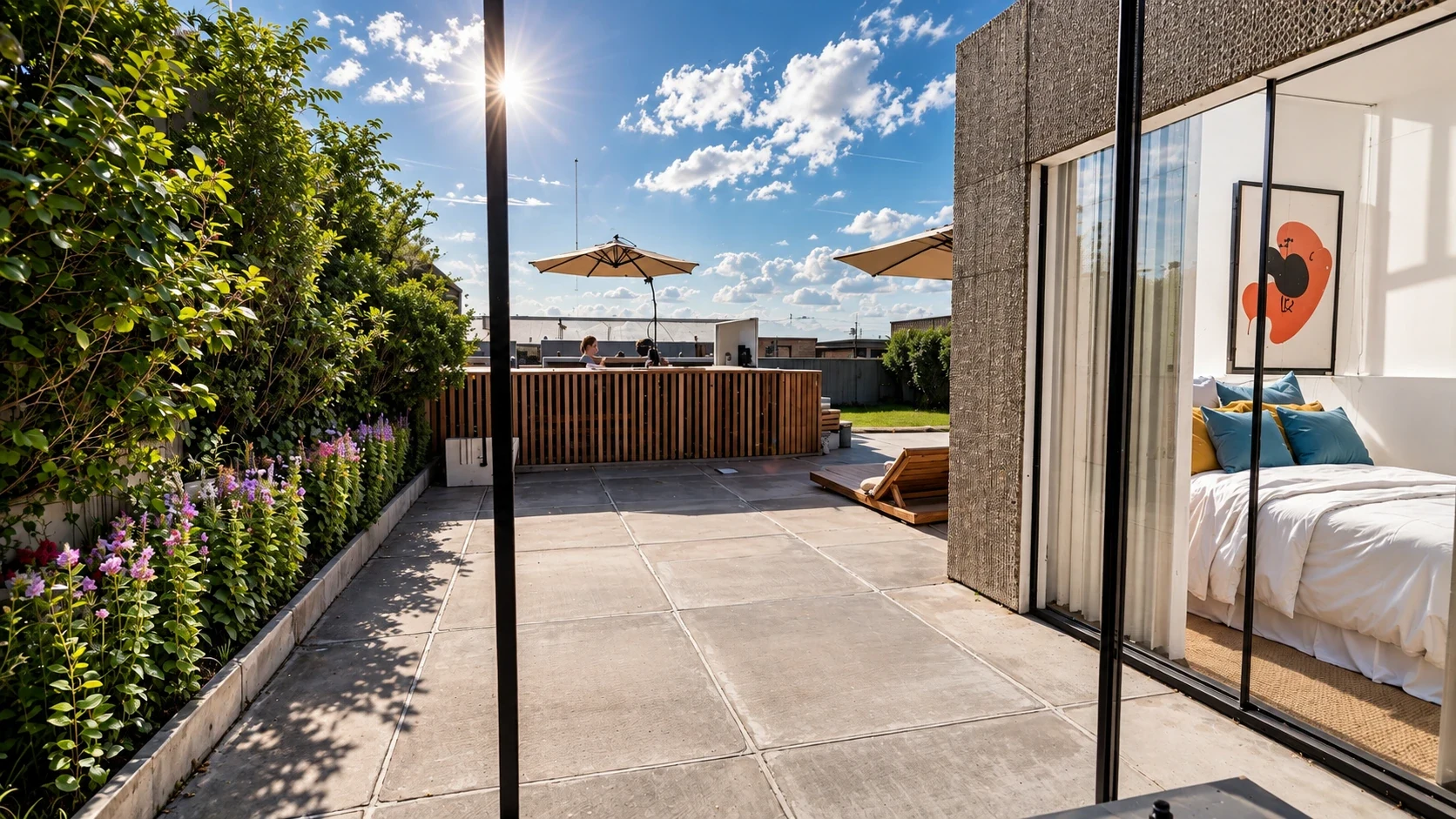 Primary suite opening directly onto a private garden deck overlooking Dubai.